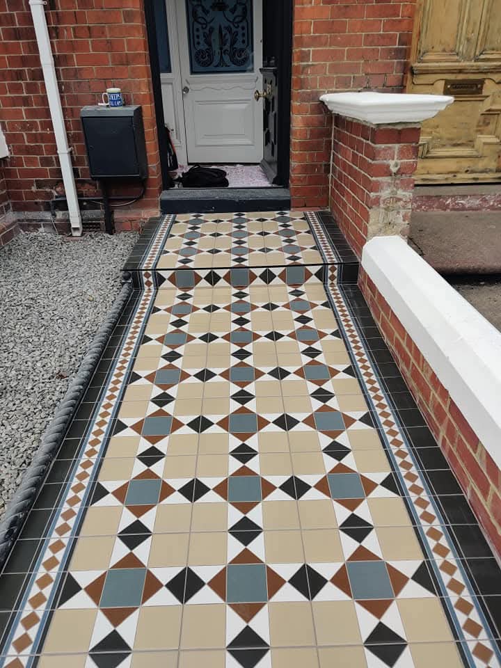 Victorian geometric mosaic pathway with diamond and square pattern