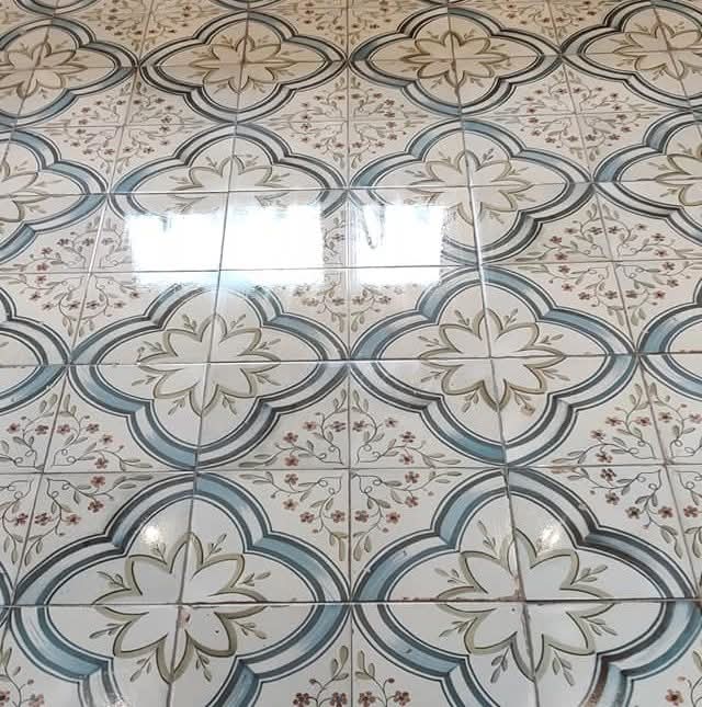 Ornate patterned floor tiles with quatrefoil design